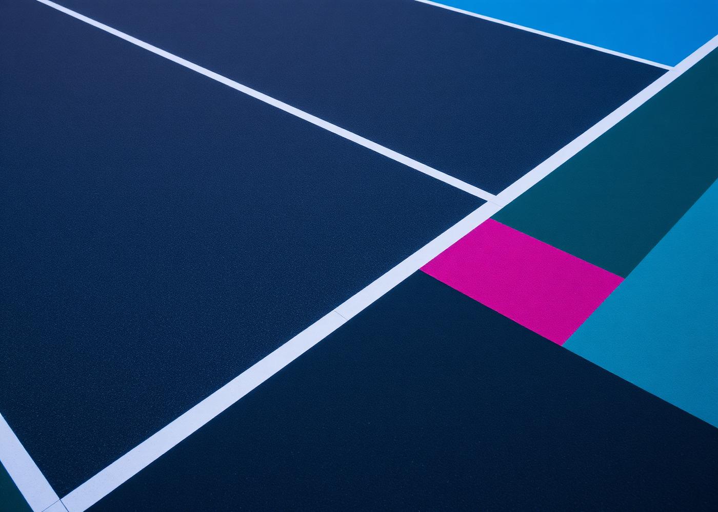 Charcoal modular sports court with white line markings and a basketball hoop