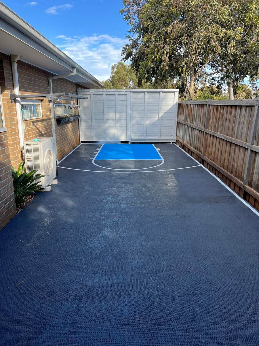 Charcoal and red half basketball court with custom centre logo